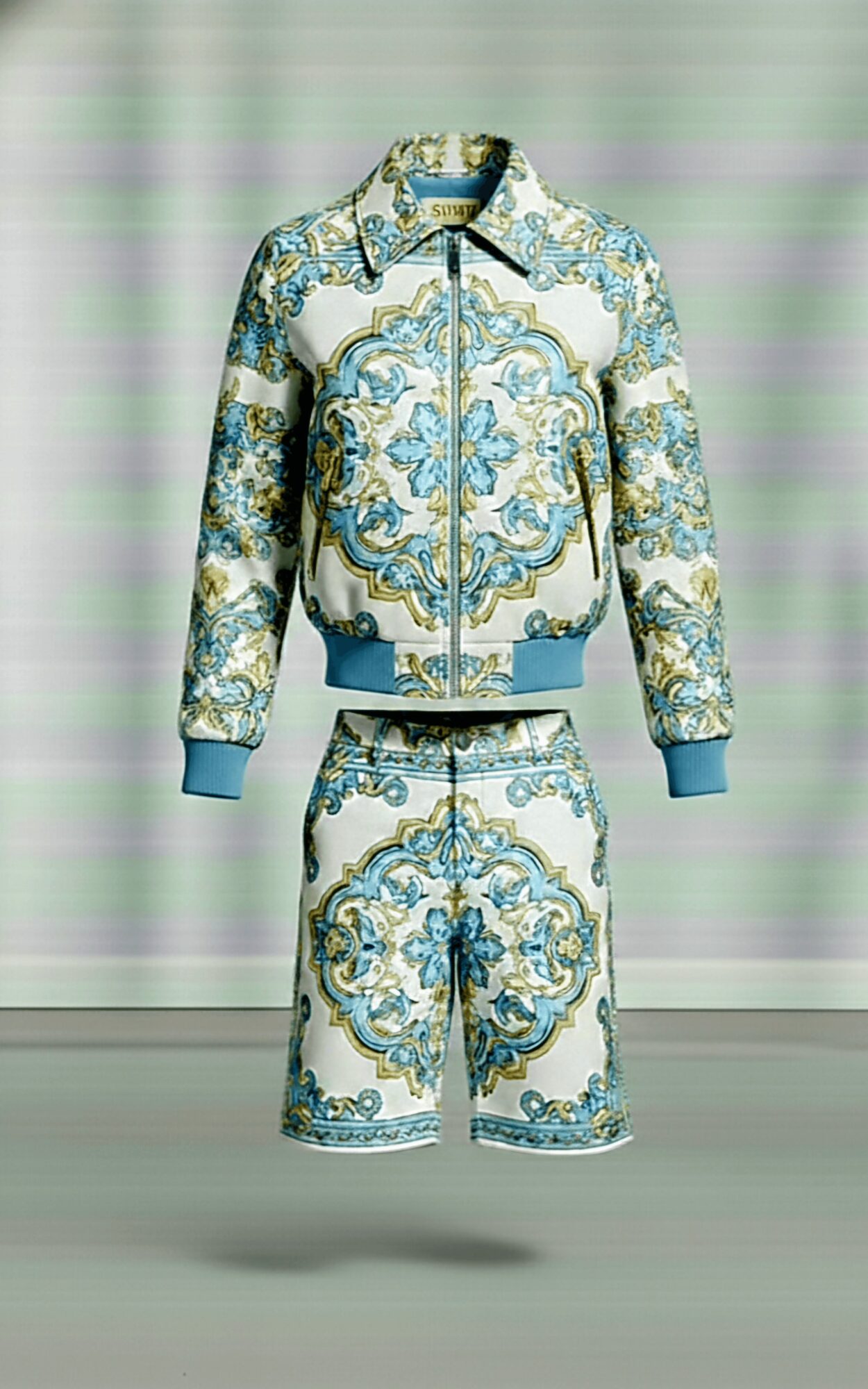A matching jacket and shorts set with ornate blue, gold, and white patterns on a light background, displayed against a striped backdrop.