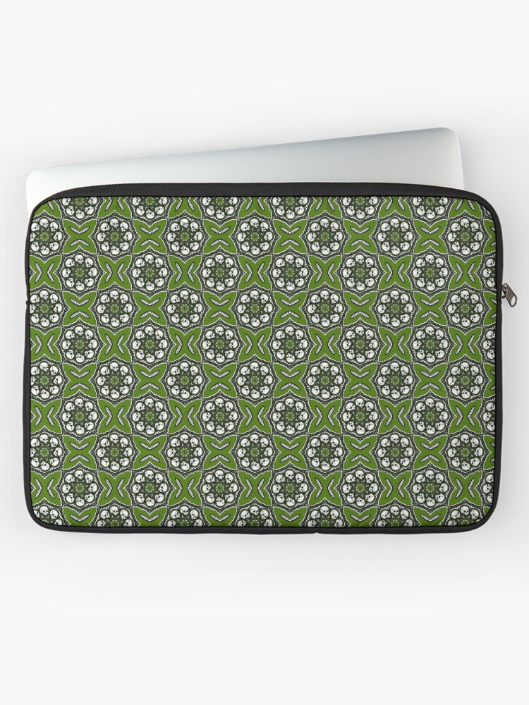 Patterned laptop sleeve with green, white, and black geometric design, partially covering a silver laptop, on a white background.